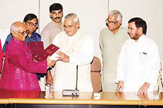 Prime Minister Atal Behari Vajpayee receives the report