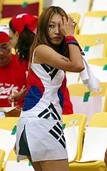 A South Korean is dressed in her national colours 