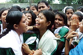 Children of Bangladeshi jute mill workers cry