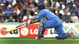 India's Sachin Tendulkar reaches to sweep the ball
