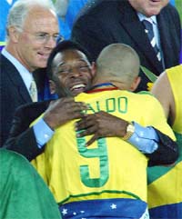 Brazil's Ronaldo hugs his compatriot Pele