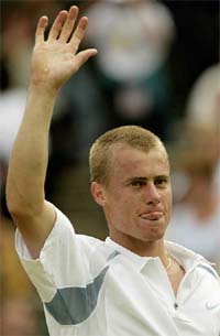 Australia's Lleyton Hewitt waves to the crowd
