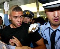 The Japanese police escorts Brazilian soccer star Ronaldo