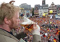 Germany�s goalkeeper Oliver Kahn drinks beer on a balcony