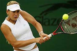 Russia's Anna Kournikova returns to Indonesia's Wynne Prakusya and Chinese Taipei's Janet Lee