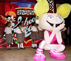 Schoolgirls watch a cartoon character