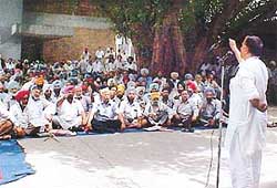A union leader from Panjab University, Chandigarh, addresses a rally at PAU