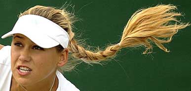 Russia's Anna Kournikova serves during her women's doubles match