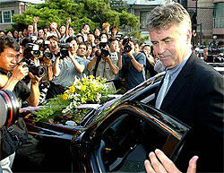 South Korea soccer coach Guus Hiddink receives a car