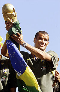 Brazilian star Rivaldo hoists the FIFA World Cup trophy