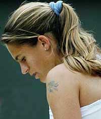France's Amelie Mauresmo shows the strain