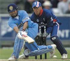 Sachin Tendulkar plays a sweep shot
