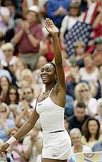 Venus Williams of the USA waves to the crowd after her semifinal victory over Belgium�s Justine Henin 