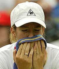 Belgium's Justine Henin holds a towel
