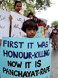 A Pakistani girl takes part in a protest