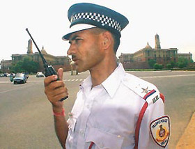 UNEASY LIES THE HEAD: This traffic police officer looks impressive in the new uniform, but it has its problems. The Rexine cap that he wears is extremely uncomfortable in the heat and humidity of Delhi. 