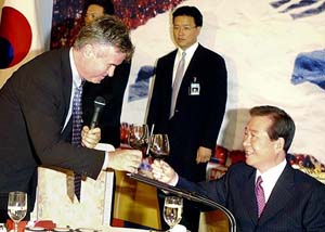 South Korean national soccer team head coach toasts with South Korean President
