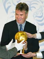 Dutch soccer coach of the South Korea national team Guus Hiddink holds a golden ball