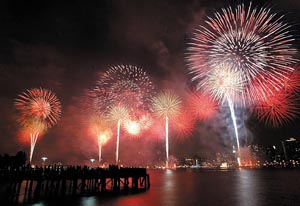 Fireworks explode over the East River