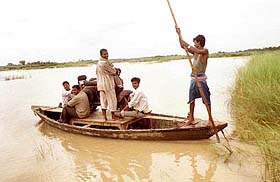 Flood-hit people leave their Aurai village