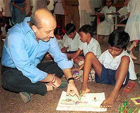 Film actor Anupam Kher with handicapped children