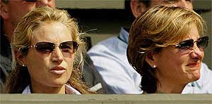Britain's Tim Henman's wife Lucy and his agent Jan Felgate react during his men's semifinals match