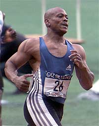 Maurice Greene of the USA crosses the finish line to win the men's 100 metres