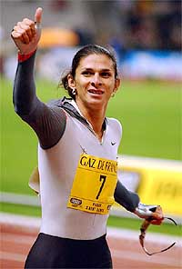 Ana Guevara of Mexico celebrates as she wins the women's 400 metres