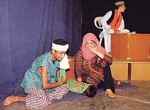 Artistes perform in a play, Hawayi Gole, which was staged at Pracheen Kala Kendra