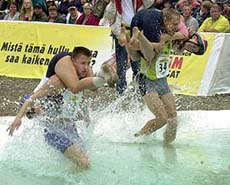Anna Zilberberg and Meelis Tammre of Estonia race Finland�s Elina Toivonen and Ilpo Haalisto 