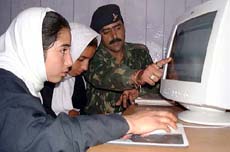 An Army officer trains two girls 