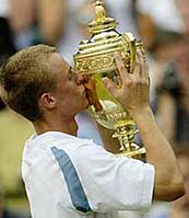 Australia's Lleyton Hewitt kisses the winner's trophy
