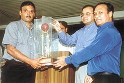 DDCA president Arun Jaitley presenting the League Trophy to Malviya Club president Pradeep Kashyap and secretary Ashok Vaswani
