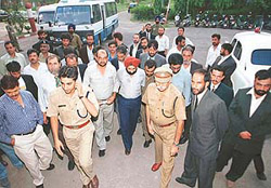 Afghan police officials along with the SP (Operations), Chandigarh Police, Mr H.G.S. Dhaliwal, at the Economic Offence Office of the police in Sector 17, Chandigarh, on Tuesday. 