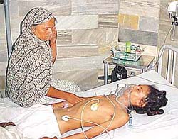 Mother of Jagroop Singh, a Class X student of Government Senior Secondary School, Pakhowal, at his bedside in Arora Neuro Centre