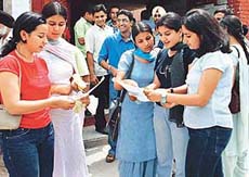 Students discuss details of the entrance test for admission to the English Department at Panjab University, Chandigarh, on Wednesday. 