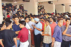 Entertainment limited, rush unlimited: Young crowd of Chandigarh waits outside a cinema hall in Sector 34 to watch first show of �Devdas� on Friday.