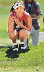 Mi Hyun Kim from Seoul, South Korea, lines up her putt on the second green in the 2002 Jamie Farr Kroger Classic LPGA event at Highland Meadows Golf Club in Sylvania, Ohio on Thursday.