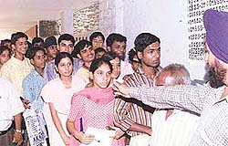 Students queue up to pay fee on the last day of centralised admissions for Class XI for government schools, in Government Model Senior Secondary School, Sector 23, Chandigarh, on Saturday.
