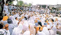 Villagers of Pakhowal protest on Saturday at the town square near the school