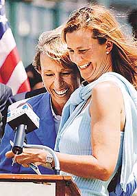 Martina Navratilova (L) hugs her longtime doubles partner Pam Shriver of the USA after introducing Shriver as the next inductee into the International Tennis Hall of Fame