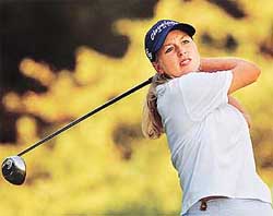US golfer Beth Bauer from Tampa, Florida, watches her drive off the 17th tee during the third day of action