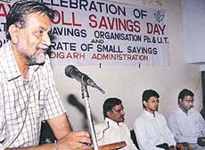 B.S. Dhaliwal, District Savings Officer, addresses a gathering on Payroll Savings Day in Sector 17