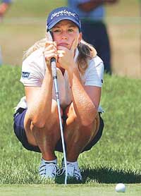 Beth Bauer of Tampa, Florida, lines up her putt on the third green during the final day of the 2002 Jamie Farr Kroger Classic LPGA event