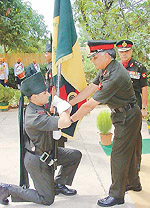 The Chief of the Western Command, Lieut-Gen S.S. Mehta, presents a banner to the Territorial Army's 105 Infantry Battalion of Rajputana Rifles, in Chandigarh on Wednesday. 
