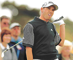 Spain's Sergio Garcia watches as his tee shot hits the rough during the first round of the 131st British Open Championship at Muirfield, Scotland on Thursday.