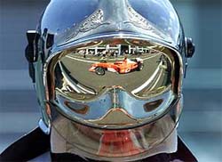 Formula One driver Michael Schumacher is reflected in the helmet 
