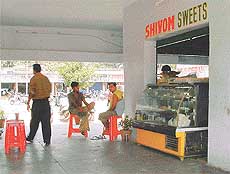 A sweetshop owner opens an �illegal� door of his shop 