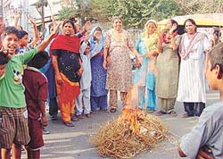Women perform a ritual to appease the rain gods in Ludhiana on Saturday