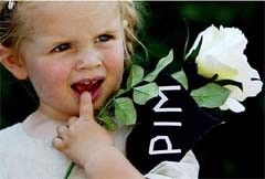 Donna holds a flower